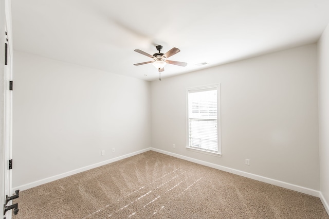 carpeted empty room with ceiling fan