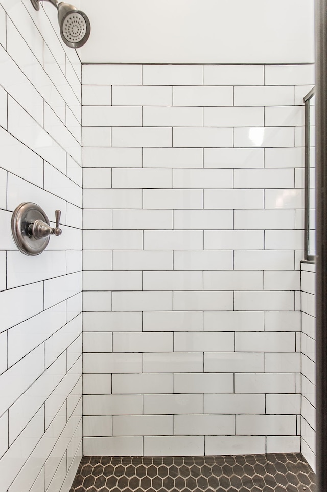 bathroom with tiled shower