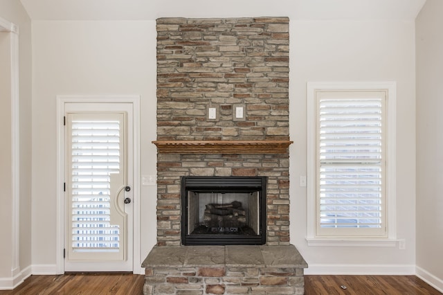 interior details with hardwood / wood-style floors and a fireplace