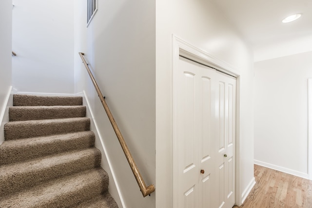 stairway featuring hardwood / wood-style flooring