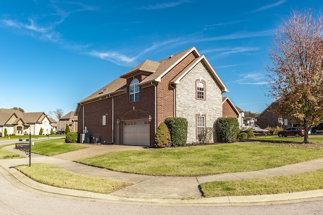 view of side of property with a garage and a yard