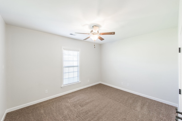 empty room featuring ceiling fan and carpet floors