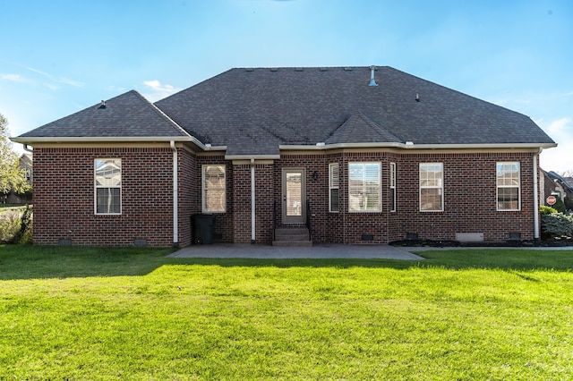 rear view of property with a patio and a lawn