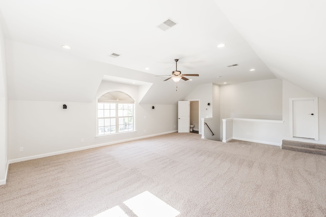 bonus room featuring vaulted ceiling, light carpet, and ceiling fan