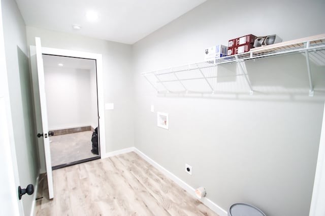 washroom with light wood-type flooring, electric dryer hookup, and hookup for a washing machine