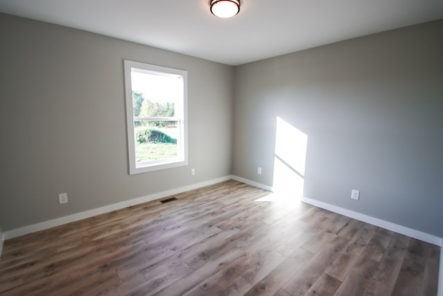 empty room featuring hardwood / wood-style flooring