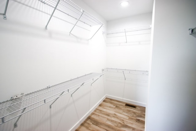 walk in closet featuring light wood-type flooring