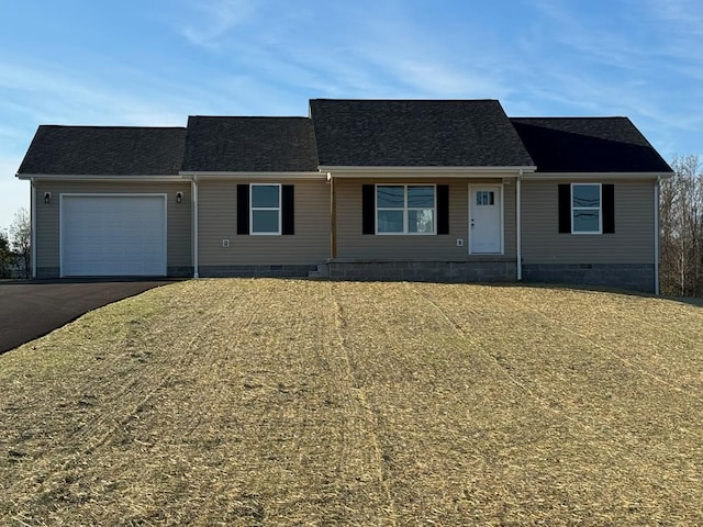 single story home with a garage and a front yard