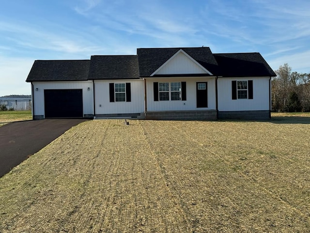 ranch-style house featuring a garage