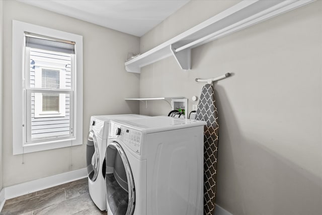 laundry area featuring washing machine and clothes dryer