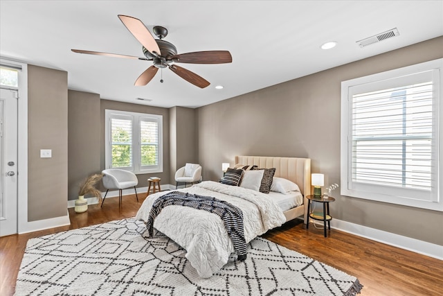 bedroom featuring hardwood / wood-style floors and ceiling fan