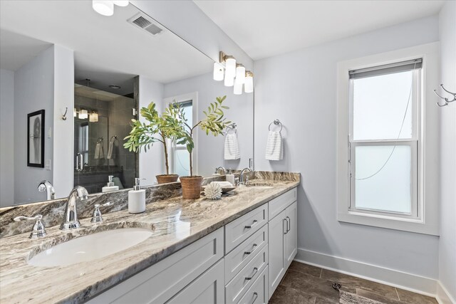 bathroom with vanity and an enclosed shower