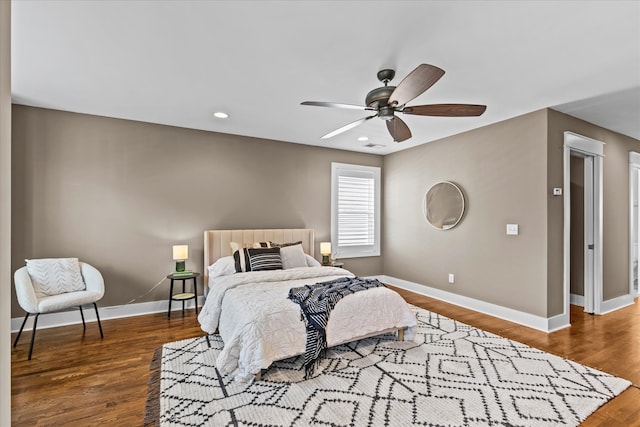 bedroom with ceiling fan and dark hardwood / wood-style floors