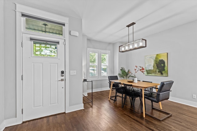 dining space featuring dark hardwood / wood-style flooring