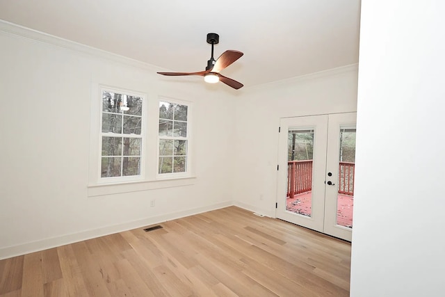 unfurnished room with french doors, light hardwood / wood-style floors, and crown molding