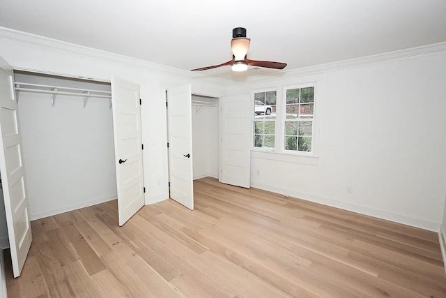 unfurnished bedroom with light wood-type flooring, ceiling fan, and crown molding