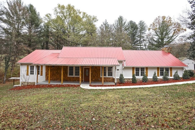 ranch-style house featuring a porch and a front yard