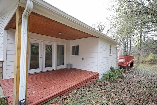 wooden deck featuring french doors