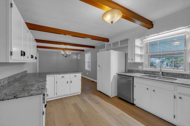 kitchen with stainless steel dishwasher, sink, pendant lighting, beam ceiling, and white cabinets