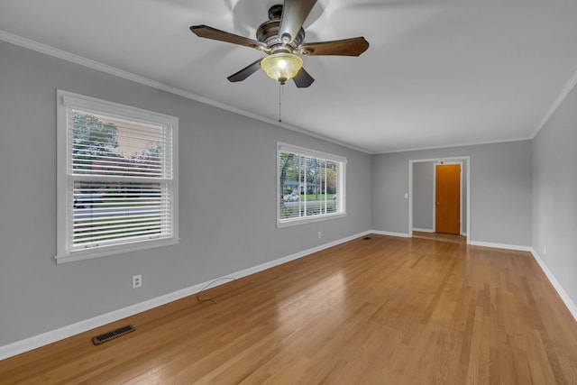 empty room featuring light hardwood / wood-style floors, ceiling fan, and ornamental molding