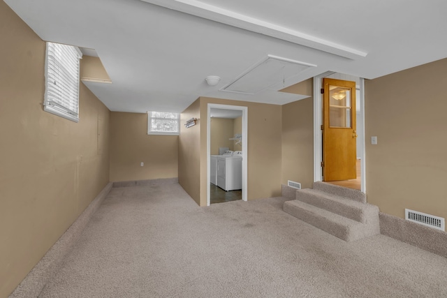 basement featuring separate washer and dryer and carpet floors