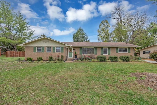 ranch-style house featuring a front lawn