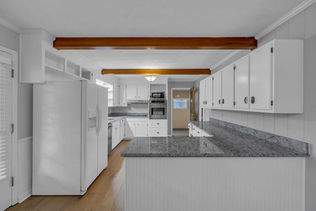 kitchen featuring white cabinetry, light hardwood / wood-style flooring, kitchen peninsula, crown molding, and appliances with stainless steel finishes