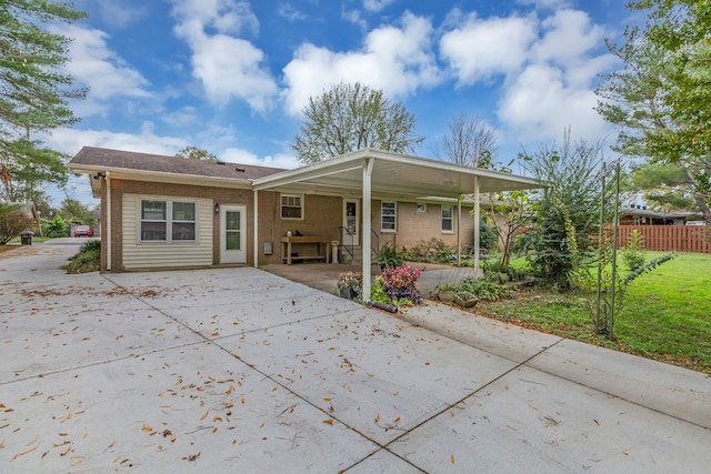 rear view of property featuring a carport