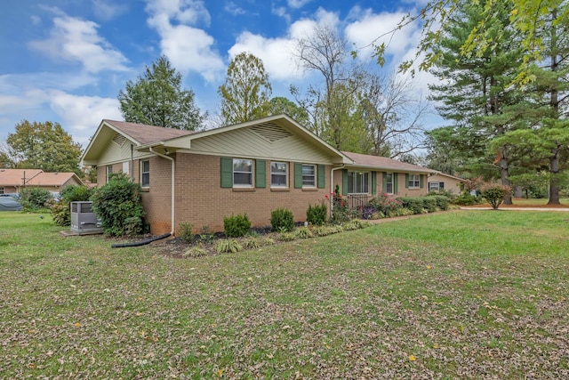 ranch-style home with a front lawn