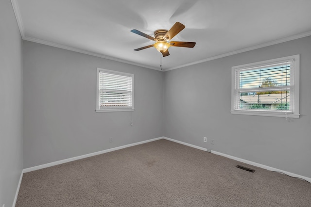 unfurnished room featuring carpet flooring, ceiling fan, and crown molding