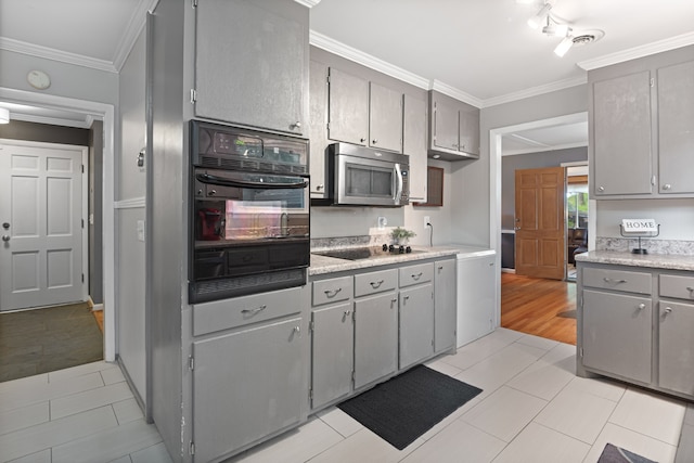 kitchen with gray cabinets, crown molding, and black appliances