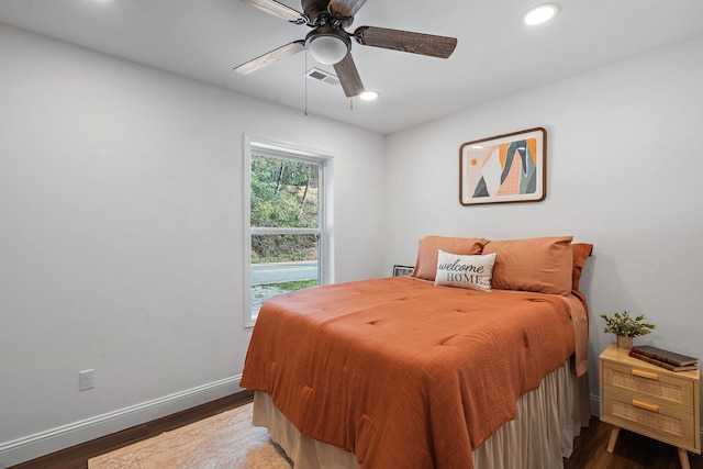 bedroom featuring hardwood / wood-style flooring and ceiling fan