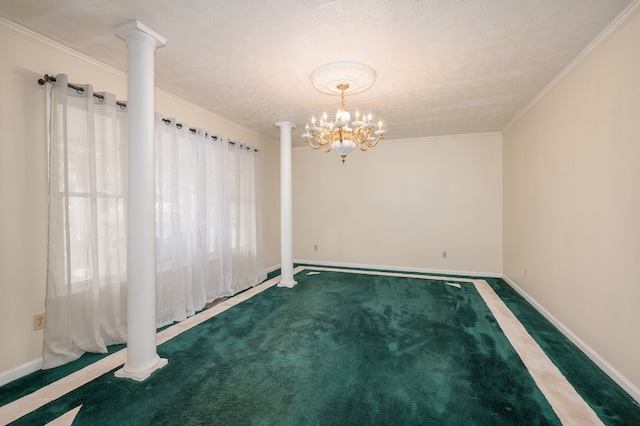 spare room with a chandelier, a textured ceiling, carpet flooring, and ornamental molding