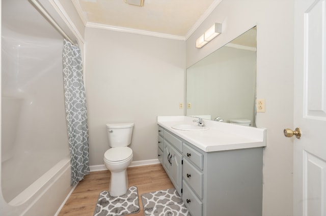 full bathroom with vanity, shower / bath combo with shower curtain, hardwood / wood-style floors, and crown molding