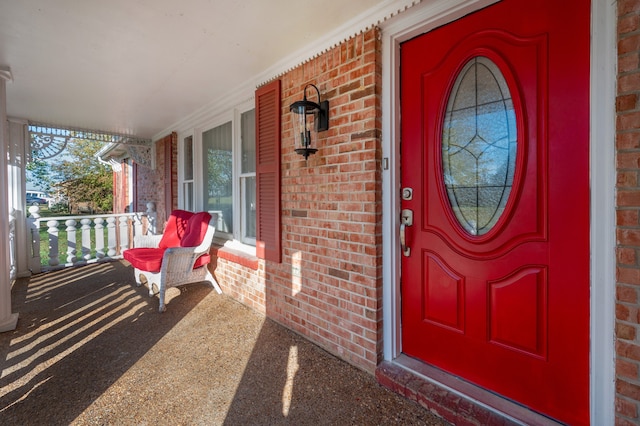 doorway to property featuring covered porch