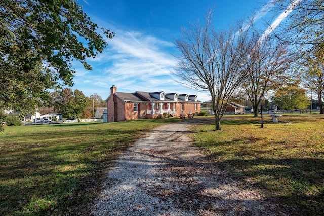 ranch-style house featuring a front lawn