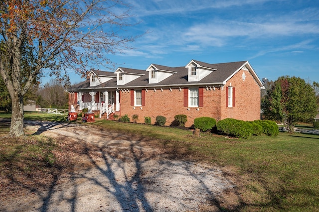 view of front of home featuring a porch and a front yard