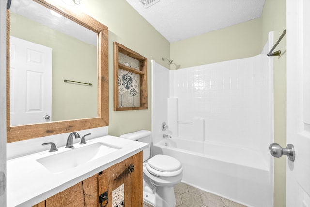 full bathroom with shower / bath combination, tile patterned floors, toilet, a textured ceiling, and vanity