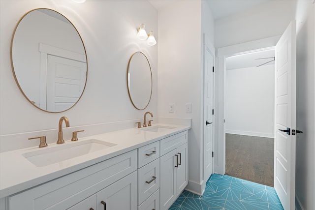 bathroom with hardwood / wood-style floors and vanity