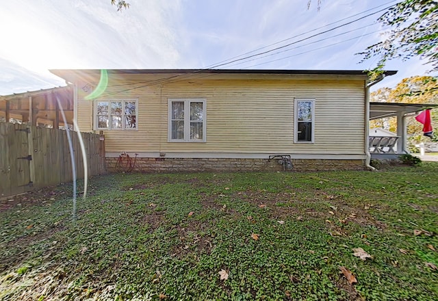 view of property exterior featuring a lawn