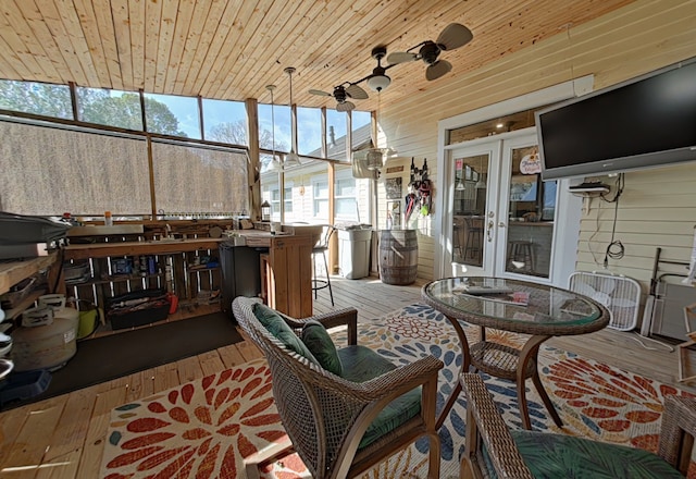 sunroom with wood ceiling and french doors