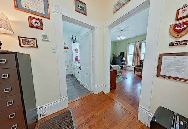 corridor featuring wood-type flooring