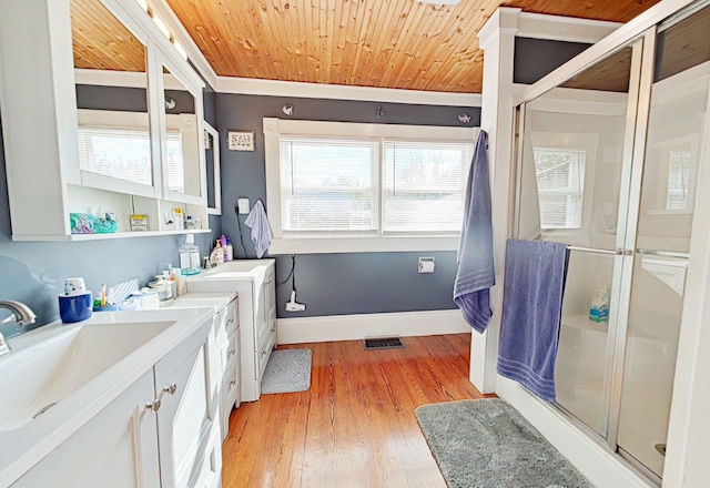 bathroom featuring plenty of natural light, wood ceiling, and hardwood / wood-style flooring