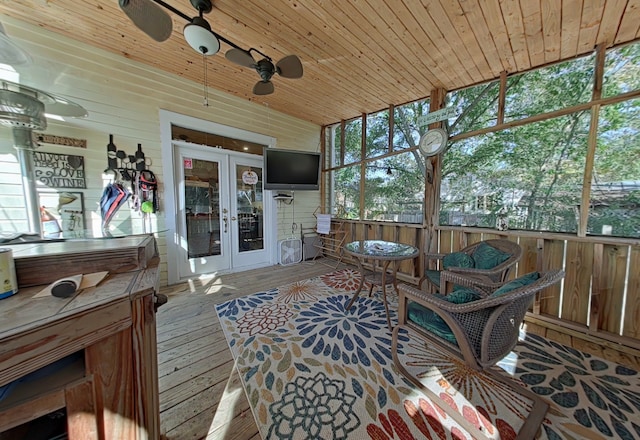 sunroom / solarium featuring wood ceiling, french doors, a healthy amount of sunlight, and lofted ceiling