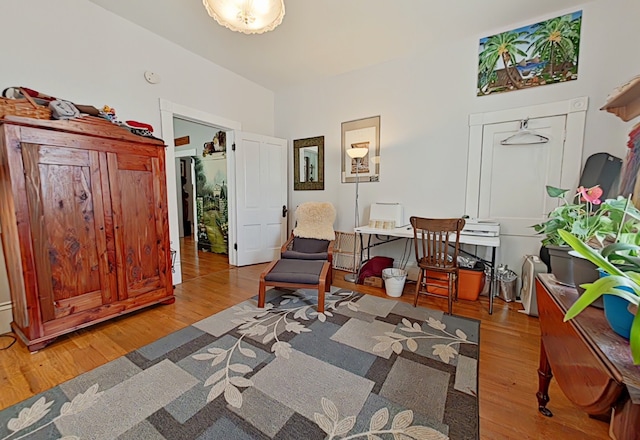 sitting room with hardwood / wood-style flooring