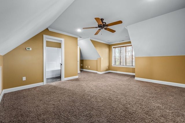 bonus room featuring lofted ceiling, carpet floors, and ceiling fan