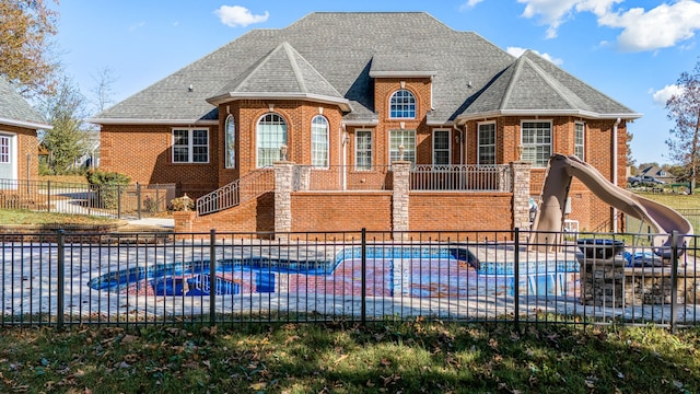 exterior space featuring a fenced in pool