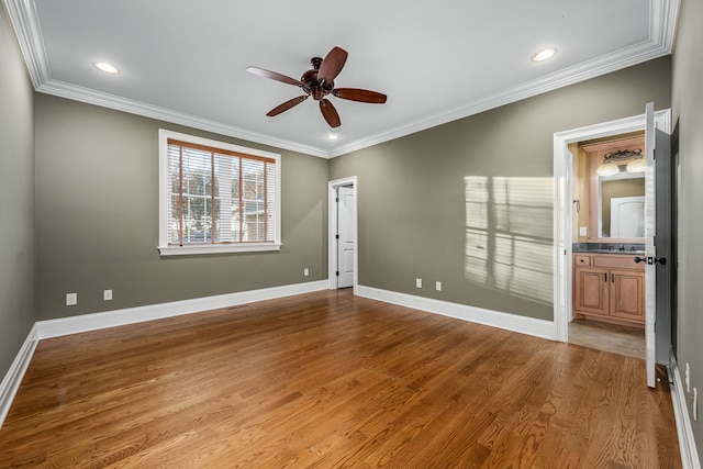 unfurnished room featuring light hardwood / wood-style flooring, ornamental molding, and ceiling fan