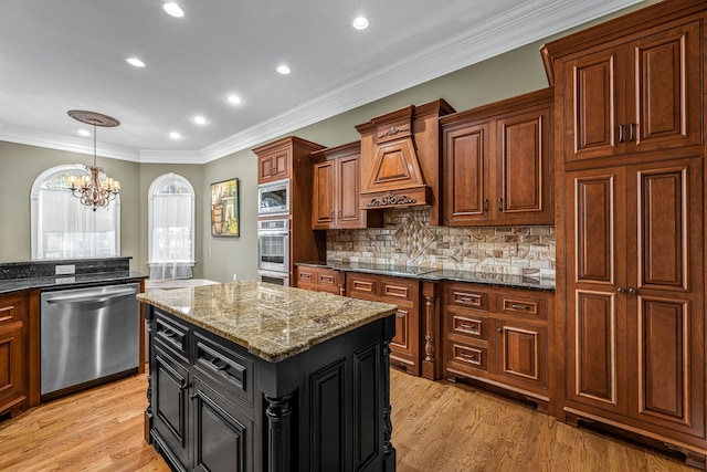 kitchen featuring stainless steel appliances, a kitchen island, light hardwood / wood-style floors, and dark stone counters