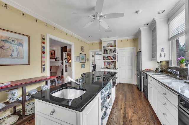 kitchen featuring stainless steel fridge, white cabinetry, sink, and ornamental molding